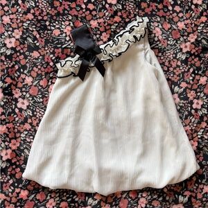 Elegant White Sleeveless Dress with Black Bow